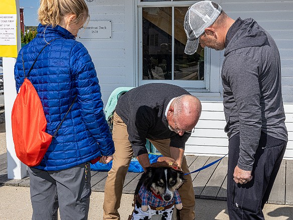 DogsOnTheDock2022-034 The new minister of the First Congregation Church of Essex, the Rev. Dave Stambaugh, blessed the dogs.