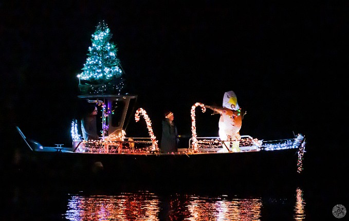 TreesInTheRigging2024-015 After the land parade is over, everyone migrates to the waterfront to watch the parade of boats with