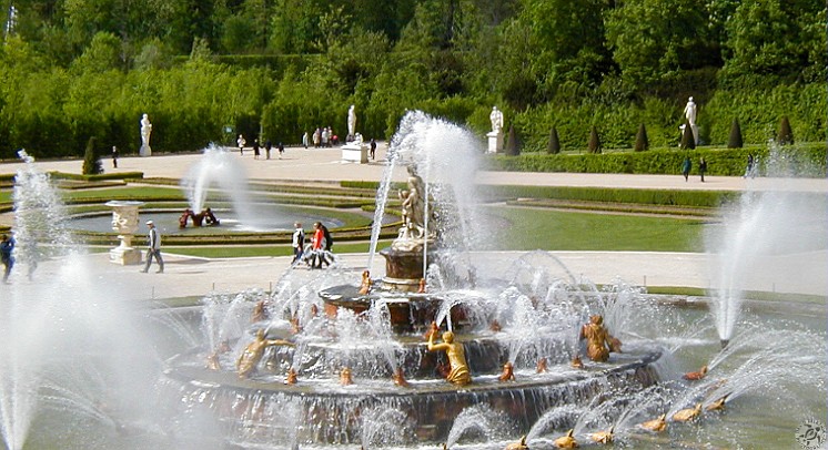 Versailles-030 The Latona Fountain representing the myth of the Greek goddess who was prevented from drinking from a pool of water by Lycean peasants. In retribution, Latona...