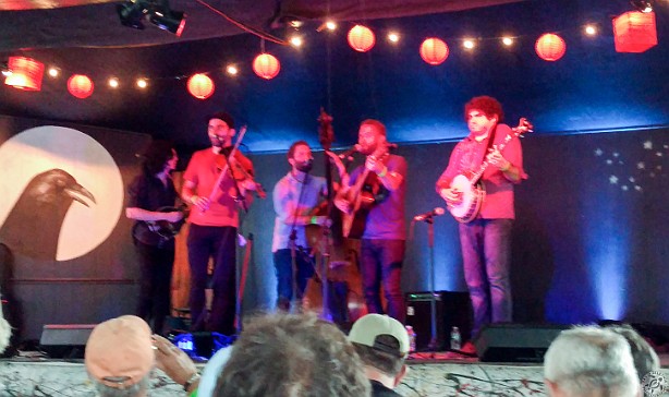 LHBOssipee2018-003 Lonely Heartstring Band on Stage Too at Ossipee Valley Music Festival 2018 rocking it under the tent while a deluge is coming down. Standing room only.