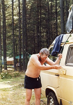 TPB1984-015 Tom Monahan in the typical solar shower/shave