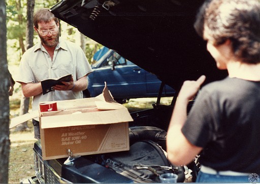 TPB1984-037 The prayer over the dipstick before refilling the engine with oil.