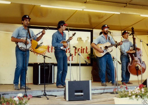 TPB1984-045 The Texas Instruments on stage for open mike. (l-r): Greg Wenzel, Dave Haletky, Tom Monahan, Jamie Peghiny